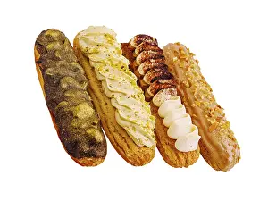 Chocolate Eclairs Prints: A tempting display of four eclairs featuring chocolate