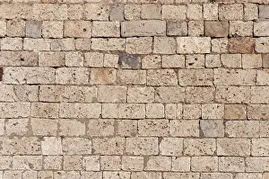 Uninhabited Stone Walls Prints: Texture of old brown limestone wall as background