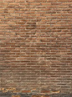 Red Brick Wall Prints: A textured red brick wall with a consistent horizontal pattern