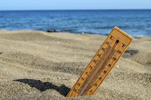Images Dated 11th September 2024: Thermometer Print on a Beach Scene