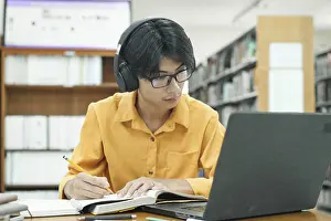 University Library Study Prints: Thoughtful Young Student Preparing for Class