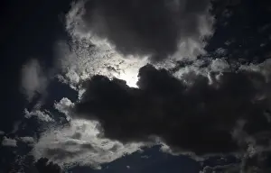 Stormy Atmosphere Prints: Thundercloud pushes in front of the sun