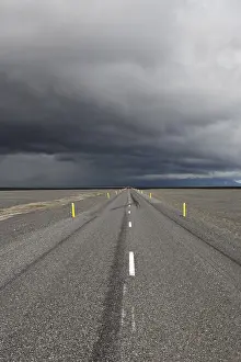 Deserted Highway Landscape Prints: Thunderclouds forming over a highway