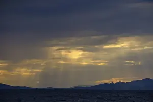 Evening Light In Southern Europe Prints: Thunderclouds at sunset on the beach