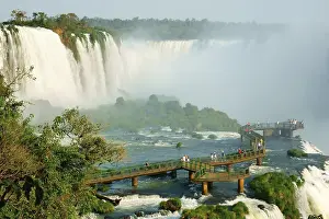 Prints of Tourists on a viewing platform, Iguazu waterfalls, Foz do Iguacu, National Park Iguazu, Parana, Brazil Tourists on a viewing platform, Iguazu waterfalls, Foz do Iguau, National Park Iguaz, Paran Brazil Heritage Site Prints: Tourists on a viewing platform, Iguazu waterfalls Print