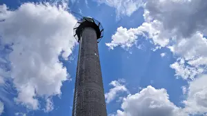 Central Europe Landmark Prints: Tower under bright blue sky with scattered clouds