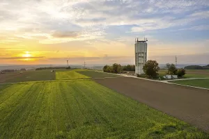 Schwarzwald Evening Atmosphere Prints: A tower next to fields under an evening sky