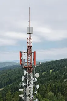 Cloudy Sky Background Image Prints: A towering communication array equipped with various antennas and dishes
