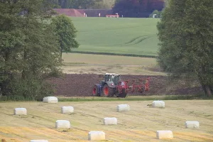 Green Fields Germany Prints: A tractor working in the field