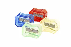 Colourful Office Supplies Prints: Four transparent colored plastic pencil sharpener
