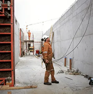 Protective Clothing Prints: Unfinished constructions construction work - setting up a wall