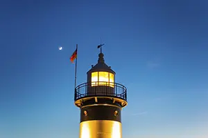 World Heritage Site Germany Prints: Upper segment of an illuminated lighthouse at night