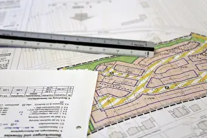 Residential Building Design Prints: Urban development plan on a desk