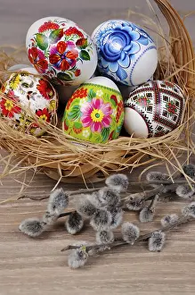 Christian Easter Traditions Prints: A variety of painted Easter eggs in a basket with willow branches