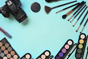 Still Life Studio Shot Prints: Various cosmetics and brushes on blue background
