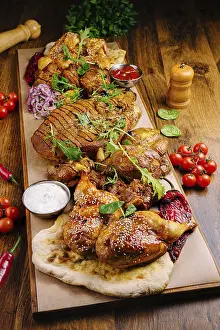 Appetizing Chicken Dishes Prints: A vibrant platter features an array of grilled chicken pieces