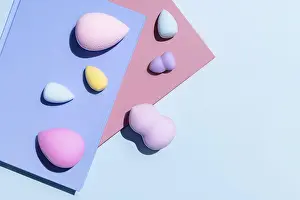 Pastel Color Background Prints: Top view of an array of multicolored makeup sponges