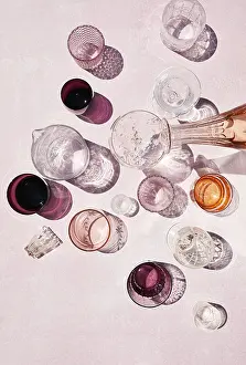 Glassware Collection Prints: Top view of assorted beverages stylishly presented in an array of glassware on a soft pink background