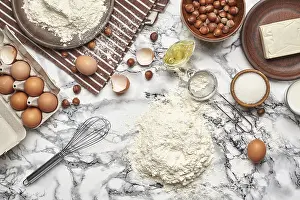 Kitchen Device Photography Prints: Top view of a baking ingredients and kitchenware on a marble background