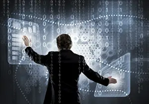 Future Business Attire Prints: Back view of businessman working with virtual panel