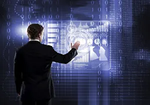 Future Business Attire Prints: Back view of businessman working with virtual panel