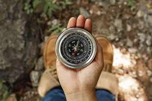 View From Above Deserted Landscape Prints: Top view female using compass directions