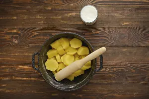 High Angle Food Photography Prints: Top view of a kitchen table with boiled potatoes in a pot