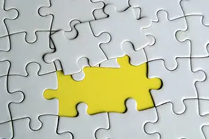 Prints of Top view of missing white jigsaw puzzles, symbolizing partnership and unity on yellow background Related Prints: Top View of Missing White Jigsaw Puzzles Print