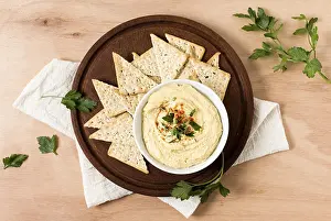 Healthy Snack Options Prints: Top view nacho chips with hummus