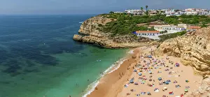 Rugged Coastline Prints: View of sandy beach with bathers