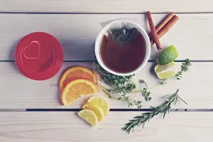 Herbal Beverage Prints: Top view of table with herb tea with orange