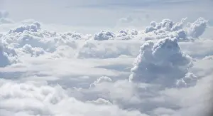 Aerial View Prints: View over towering clouds, cloudy sky