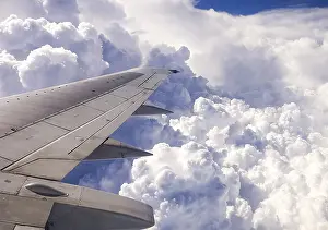 Passenger Plane Window View Prints: The view from the window of a passenger plane during the flight