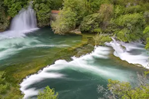 Southeastern Europe Scenery Prints: A waterfall flows into a river