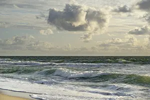 Coastal Area In Europe Prints: Waves on the beach, cloudy sky
