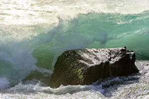 Deserted Coastal Scene Prints: Waves breaking on the stone during sunset