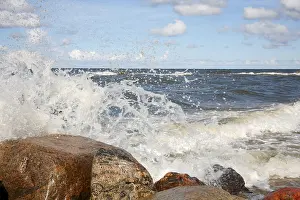 Uninhabited Shoreline Prints: The waves breaking on a stony beach