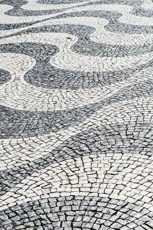 Deserted Portuguese Streets Prints: Wavy pattern in pavement, black and white