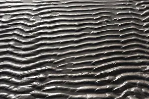 Empty Beach Scene Prints: Wavy pattern of sand on a beach