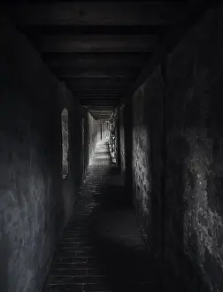 Deserted Corridors Prints: Weathered passageway in low light