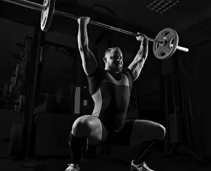Fitness Studio Workout Prints: Weightlifter does an exercise with a barbell
