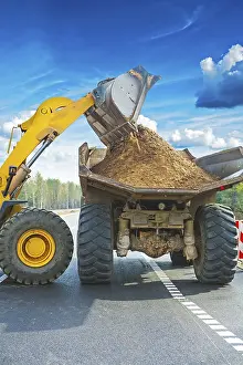 Industrial Equipment Prints: Wheel loadder loadding ground on tipper