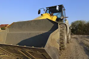 Mutterstadt Development Area Prints: Wheel loader at sunset, here in the RingstraBe development area (Mutterstadt)