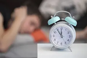 White Alarm Clock Prints: White alarm clock on the bedside table