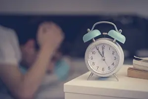 Relaxing Bedroom Scene Prints: White alarm clock on the bedside table