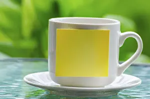 Copy Space Image Prints: White cup with empty sticky notepad