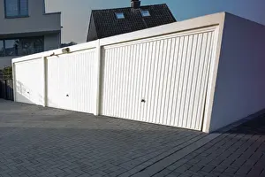 Door Prints: White Garage Doors in Morning Sun Print