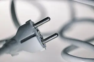 Studio Shot Germany Prints: White power plug, Schuko plug with tangled power cable