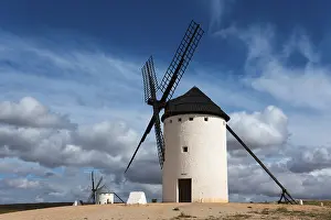 Campo De Criptana Landscape Prints: White windmill under a dramatic sky with other mills in the background