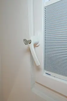 German Architecture Style Prints: Detail of a white window handle with integrated blind